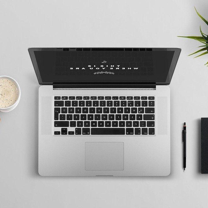 Laptop with Person Holding Coffee Cup